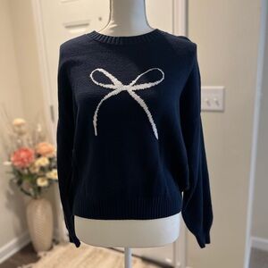 Hollister Women’s navy blue with white bow sweater size small